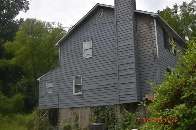 a backyard of a house with lots of green space