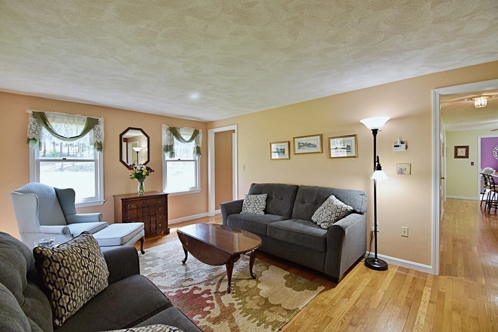 9 Chard Road Tyngsborough, MA 01879 - Photo 13 of 38 a living room with furniture and a large window