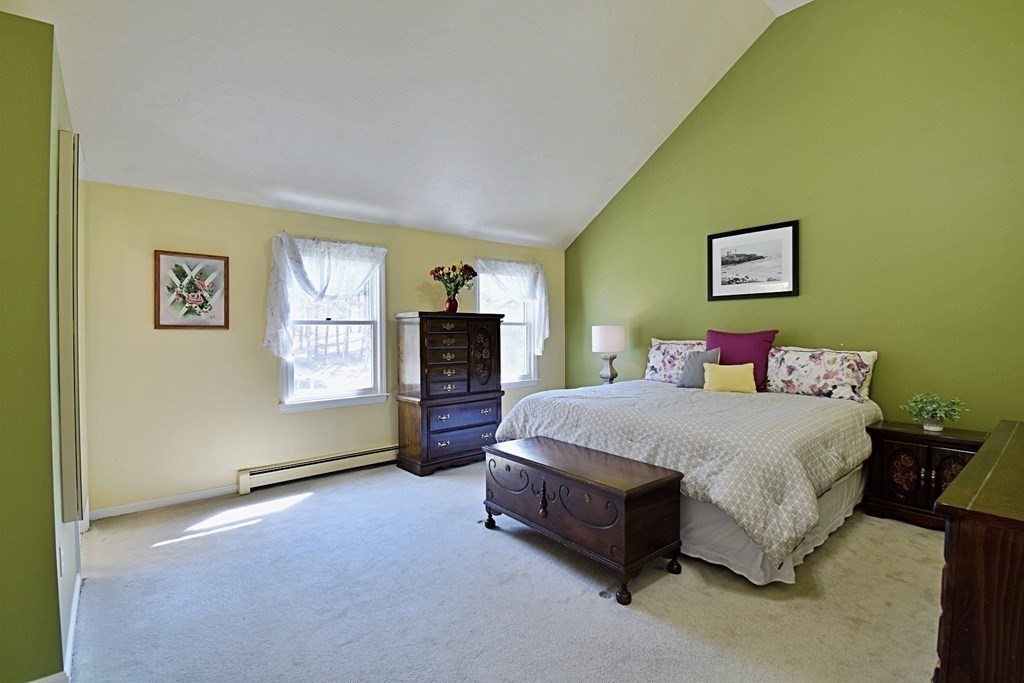 9 Chard Road Tyngsborough, MA 01879 - Photo 19 of 38 a spacious bedroom with a bed and a couch