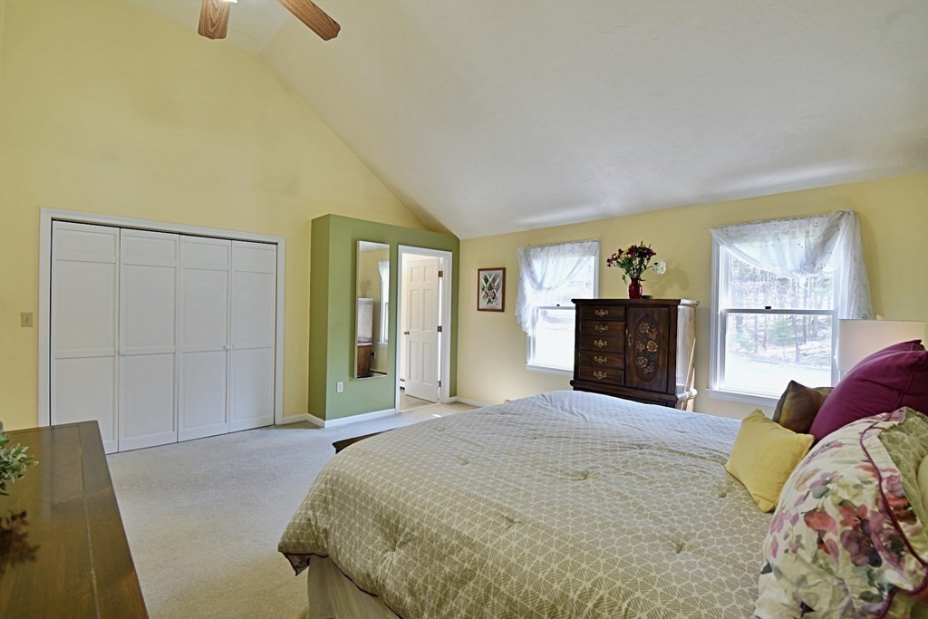 9 Chard Road Tyngsborough, MA 01879 - Photo 20 of 38 a bedroom with a bed and a couch