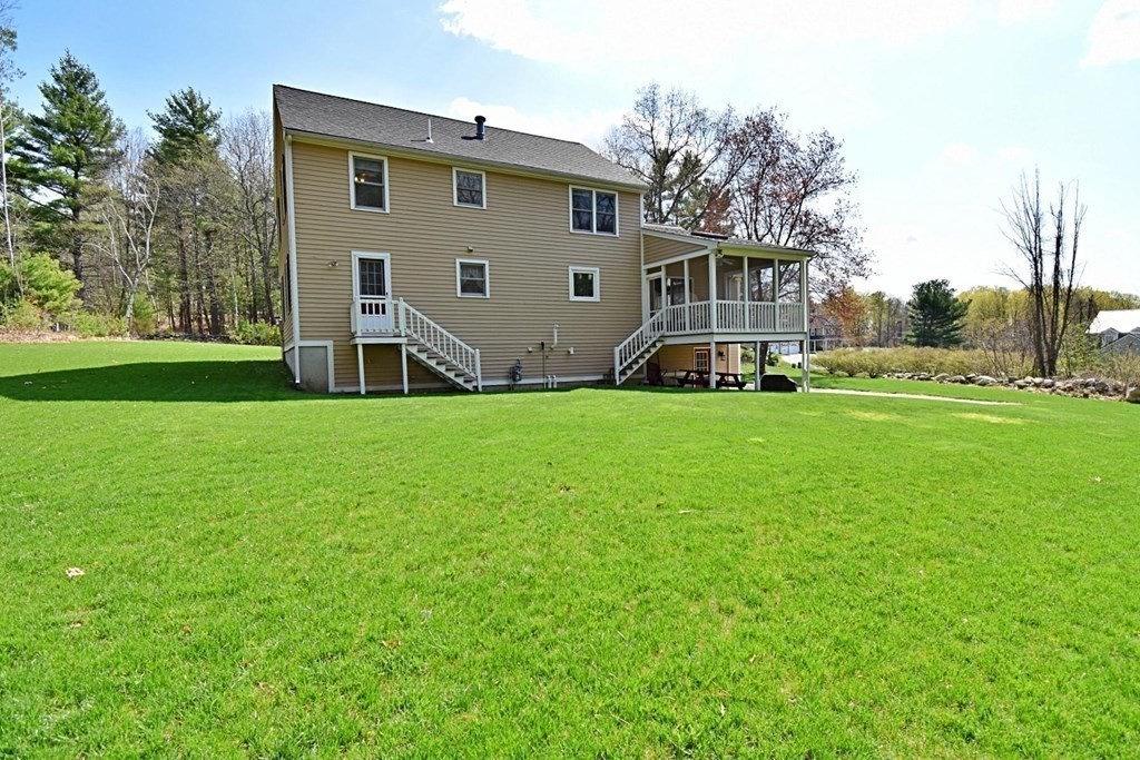 9 Chard Road Tyngsborough, MA 01879 - Photo 34 of 38 a view of a house with a backyard