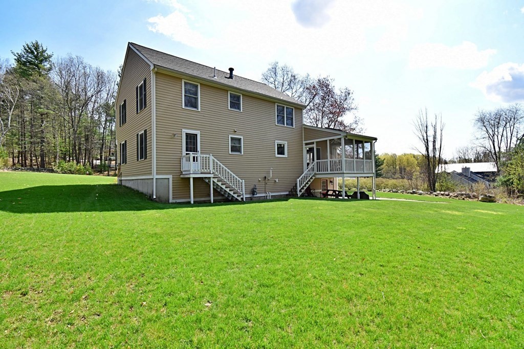 9 Chard Road Tyngsborough, MA 01879 - Photo 36 of 38 a front view of house with garden