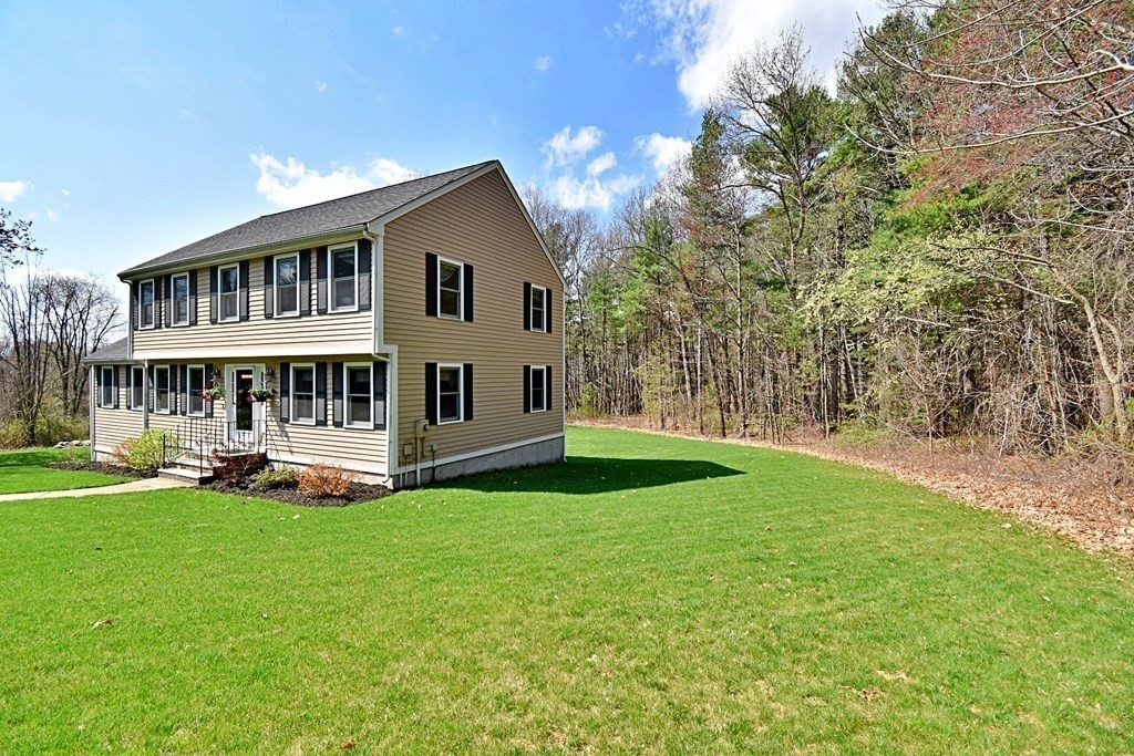 9 Chard Road Tyngsborough, MA 01879 - Photo 37 of 38 a view of a house with a yard and sitting area