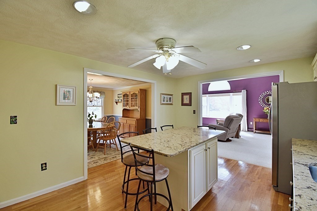 9 Chard Road Tyngsborough, MA 01879 - Photo 4 of 38 a view of a dining room with furniture and wooden floor