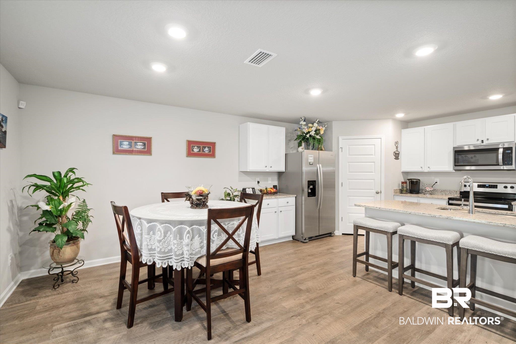 446 Paget Drive East Mobile, AL 36608 - Photo 6 of 20 Dining room featuring sink and light hardwood / wood-style floors