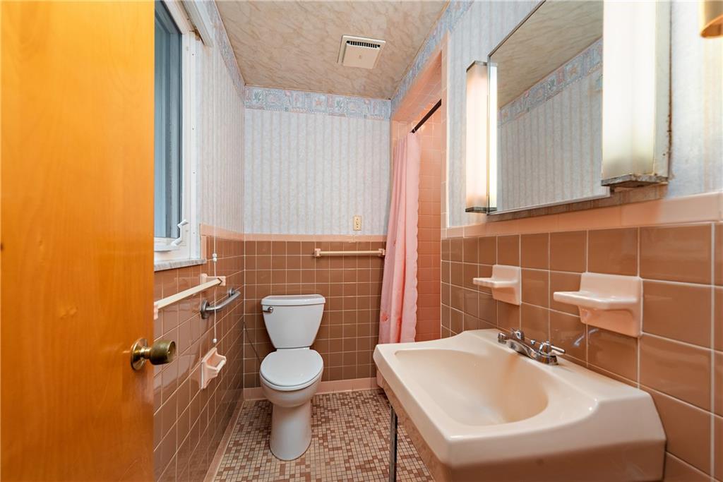 110 Forresta Drive Butler, PA 16002 - Photo 16 of 25 a bathroom with a sink toilet and mirror