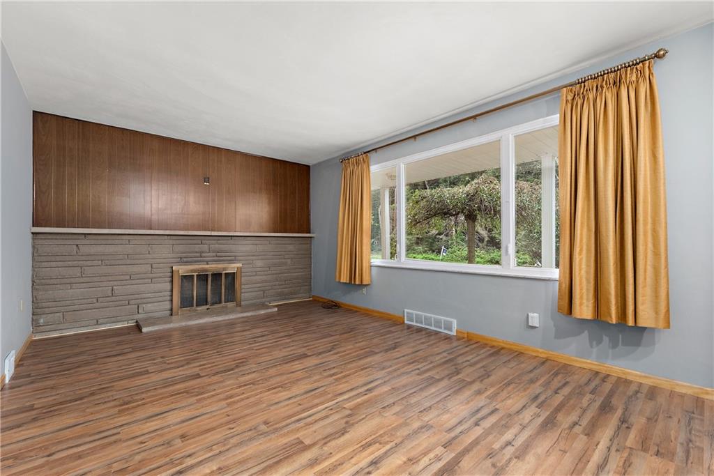 110 Forresta Drive Butler, PA 16002 - Photo 3 of 25 a view of an empty room with a window and wooden floor
