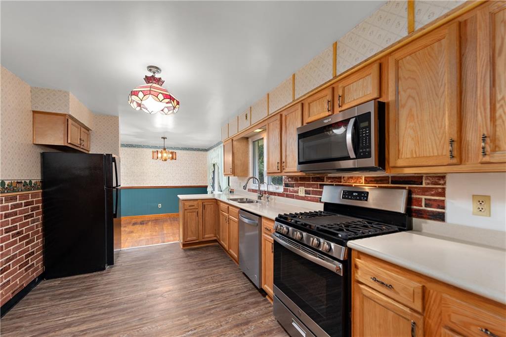 110 Forresta Drive Butler, PA 16002 - Photo 10 of 25 a kitchen with stainless steel appliances a stove refrigerator sink and microwave
