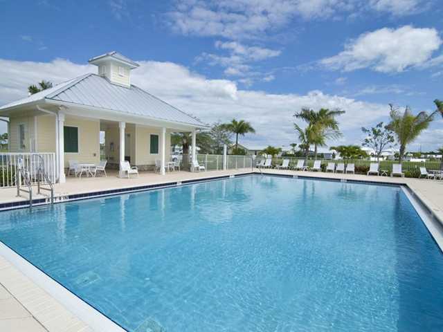 1011 Key Largo Street Jupiter, FL 33458 - Photo 4 of 6 a view of a swimming pool and lounge chair