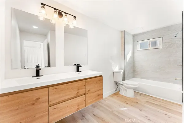 a bathroom with a sink a toilet and a bathtub