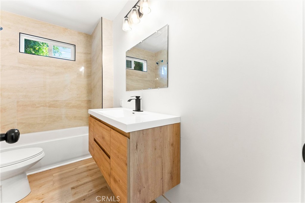 10872 Flower Avenue Stanton, CA 90680 - Photo 16 of 26 a bathroom with a sink a toilet and shower