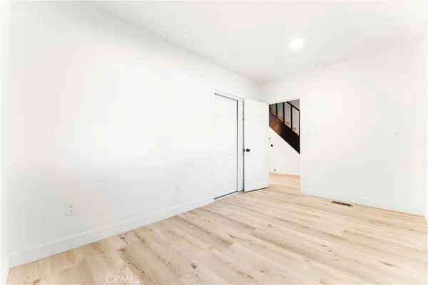 a view of a room with a ceiling fan