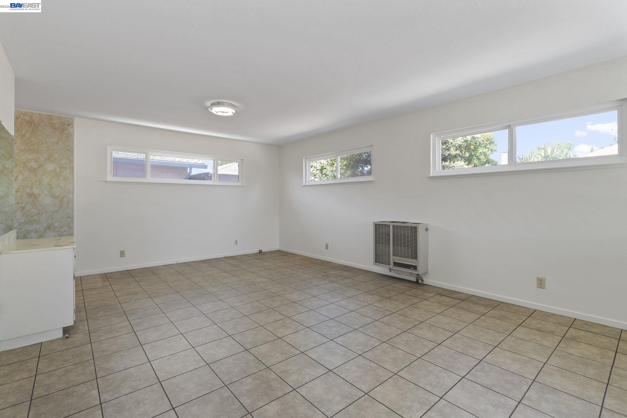 40272 Davis Street Fremont, CA 94538 - Photo 13 of 46 an empty room with windows