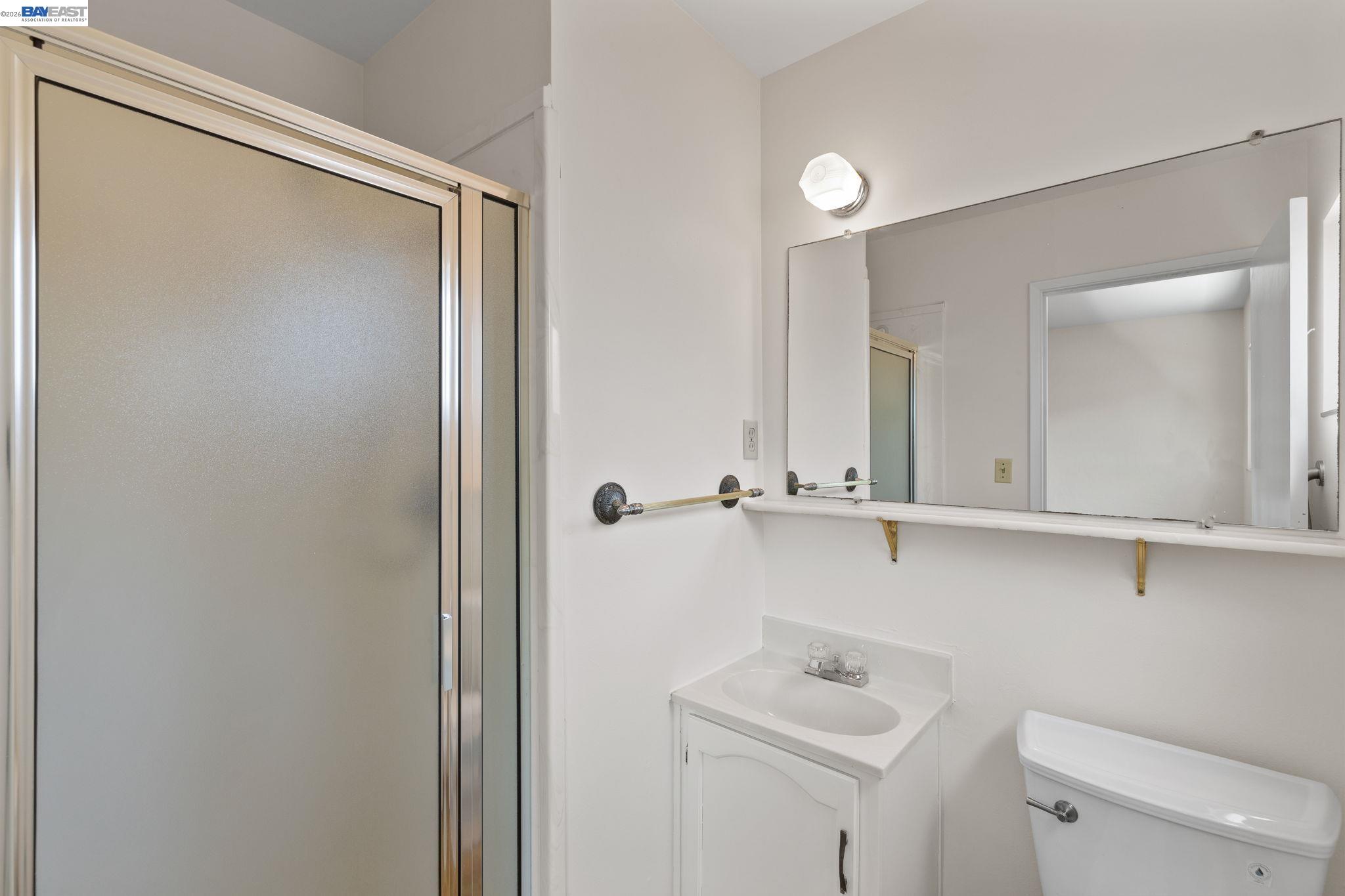 40272 Davis Street Fremont, CA 94538 - Photo 20 of 46 a bathroom with a sink and mirror