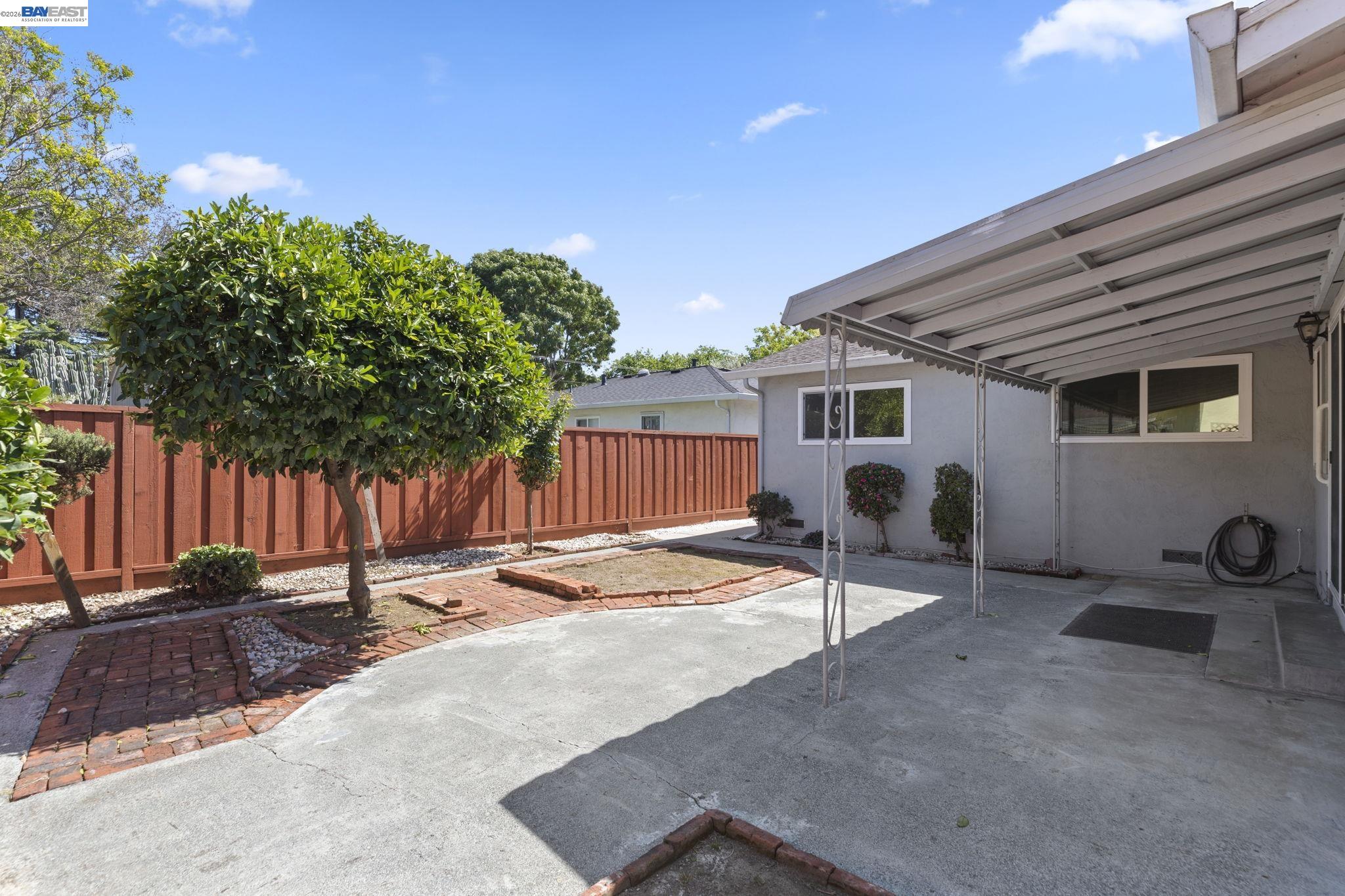 40272 Davis Street Fremont, CA 94538 - Photo 36 of 46 a backyard of a house with table and chairs