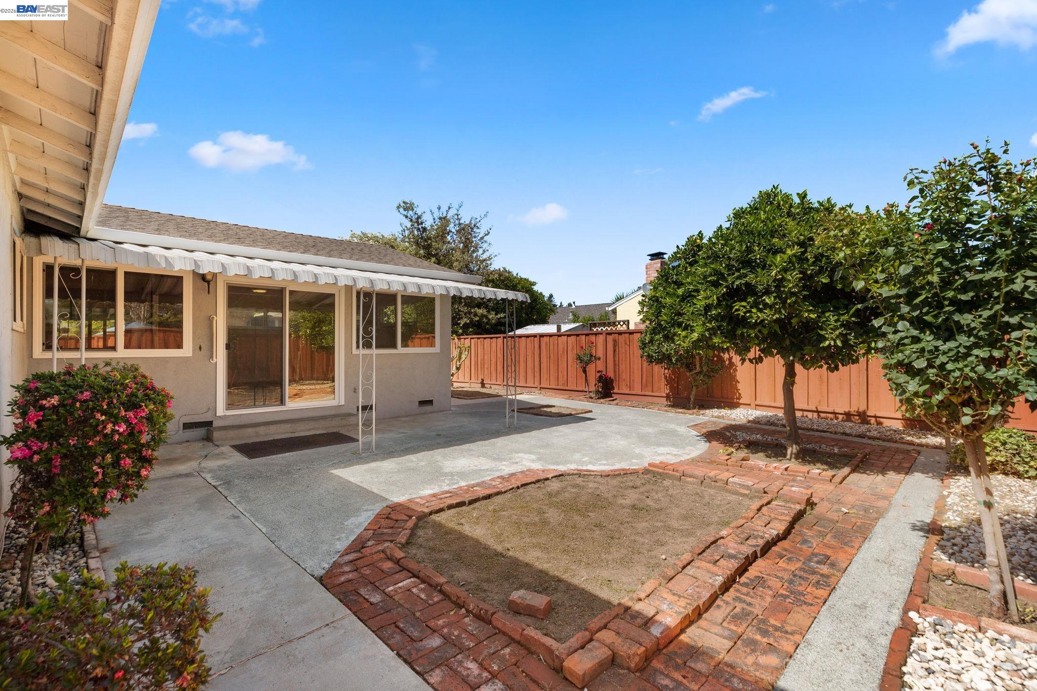 40272 Davis Street Fremont, CA 94538 - Photo 37 of 46 a front view of a house with a garden
