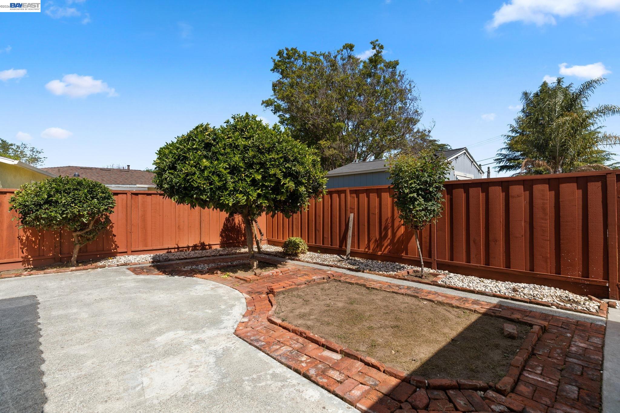 40272 Davis Street Fremont, CA 94538 - Photo 38 of 46 a backyard of a house with table and chairs