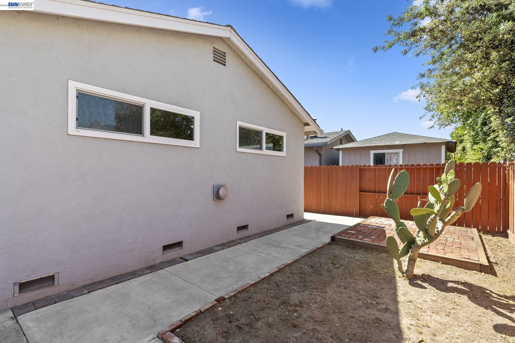 40272 Davis Street Fremont, CA 94538 - Photo 40 of 46 a backyard of a house with table and chairs