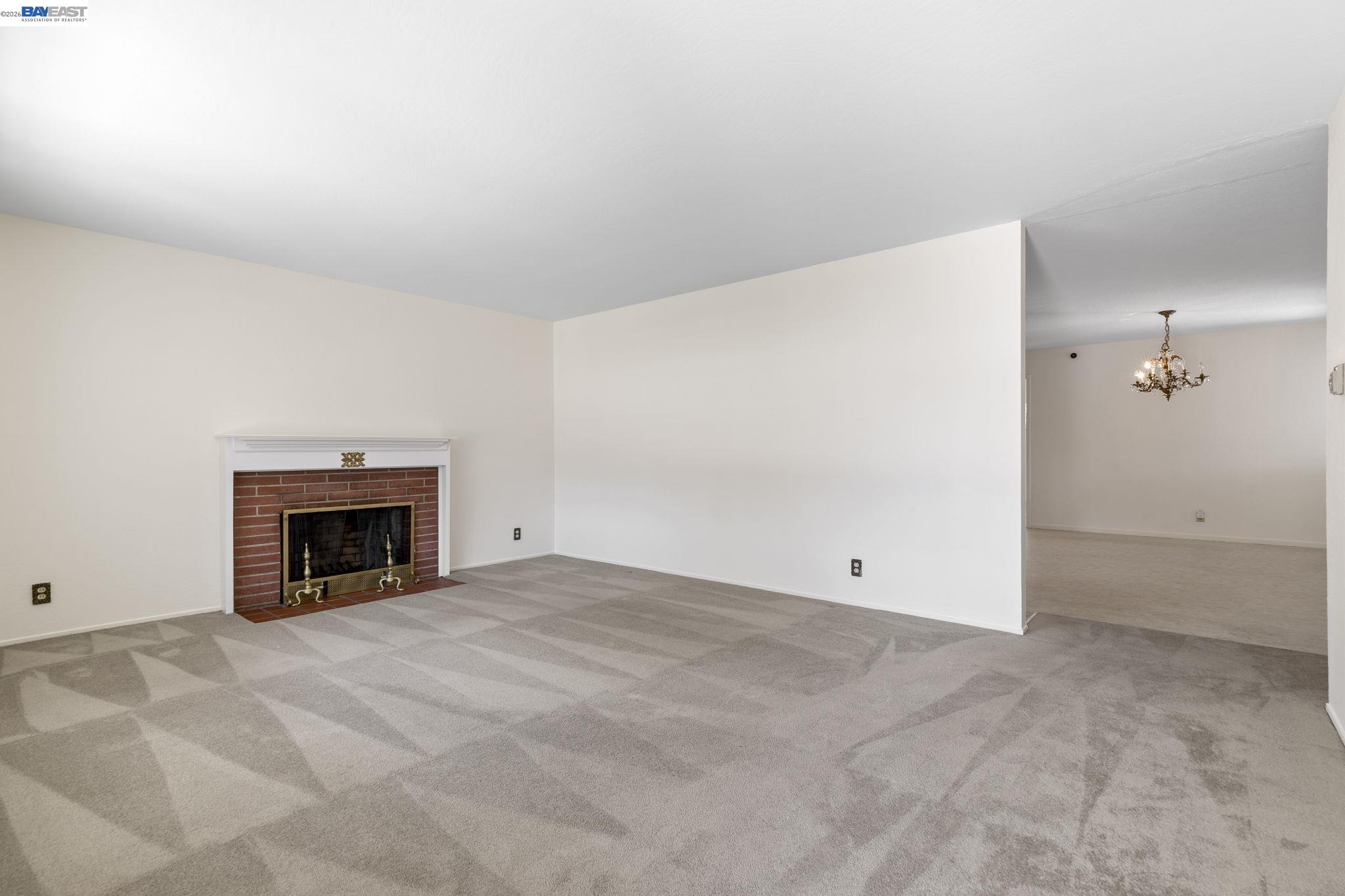 40272 Davis Street Fremont, CA 94538 - Photo 5 of 46 a view of empty room with a fireplace