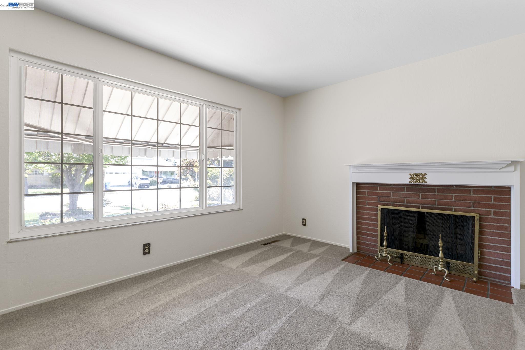 40272 Davis Street Fremont, CA 94538 - Photo 6 of 46 a view of empty room with a fireplace