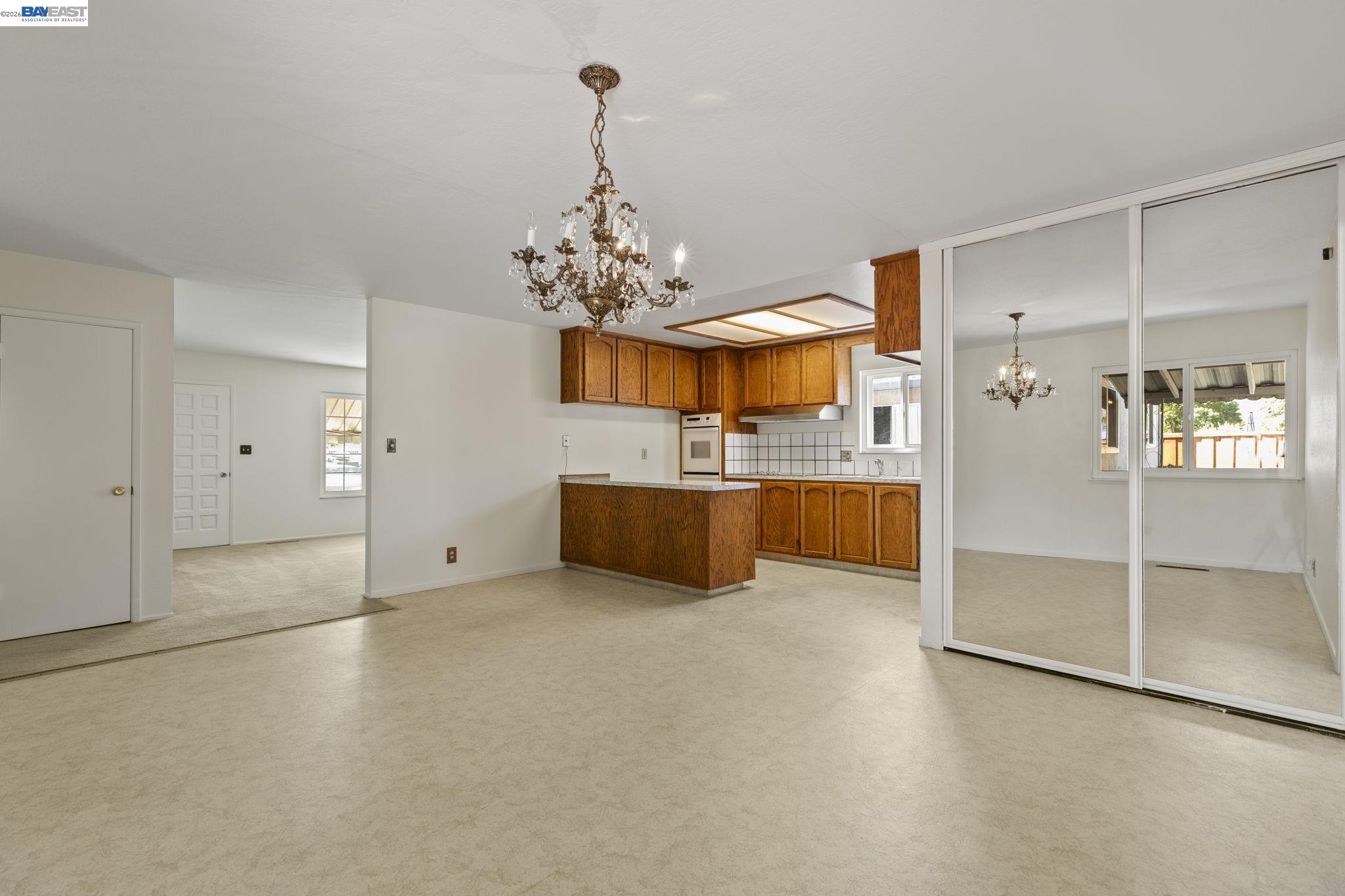 40272 Davis Street Fremont, CA 94538 - Photo 7 of 46 a view of a kitchen with a sink and refrigerator