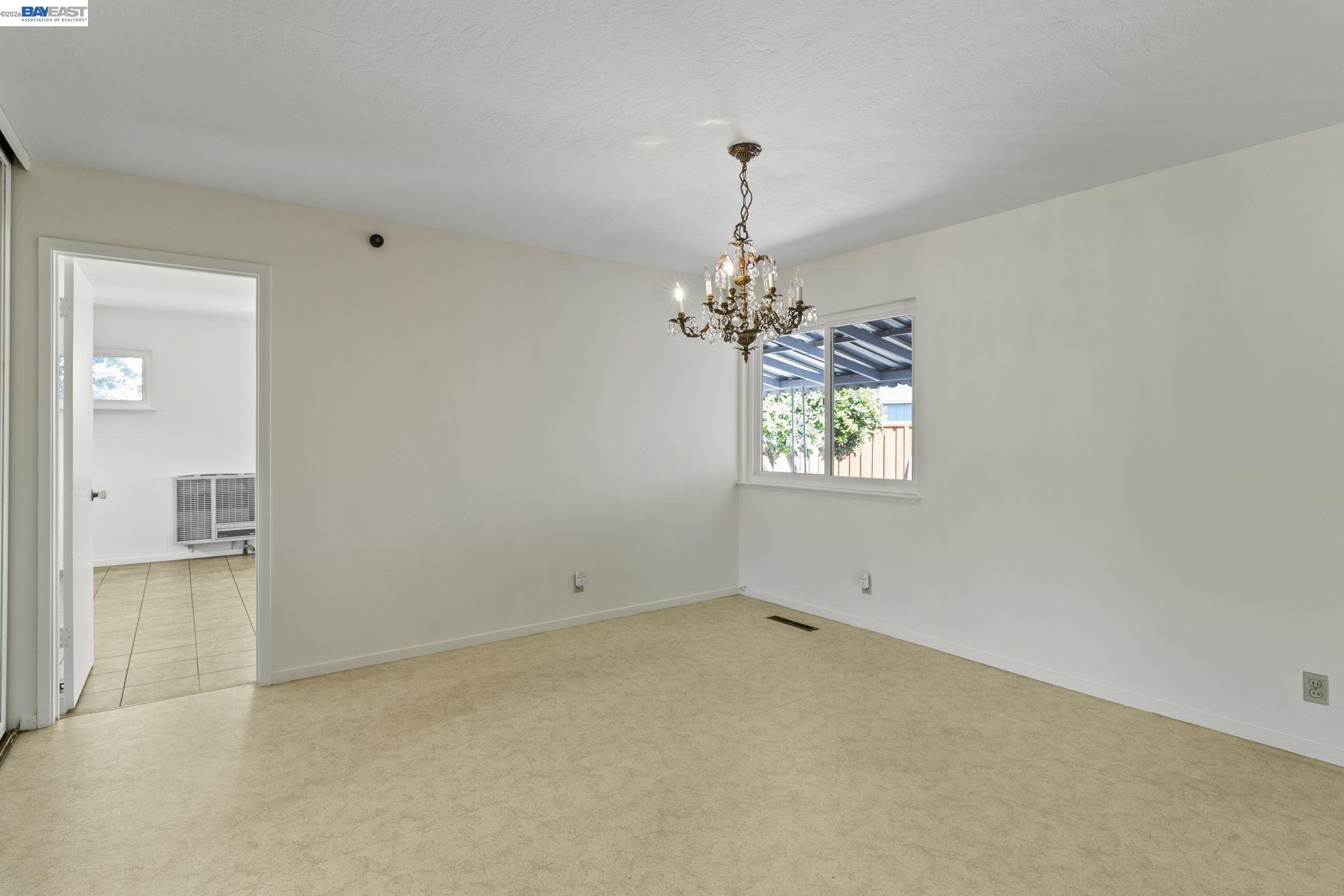 40272 Davis Street Fremont, CA 94538 - Photo 10 of 46 an empty room with chandelier