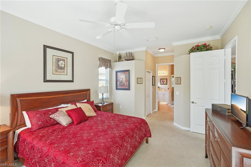 3553 Periwinkle Way Naples, FL 34114 - Photo 27 of 43 Bedroom featuring light colored carpet, ceiling fan, crown molding, and baseboards