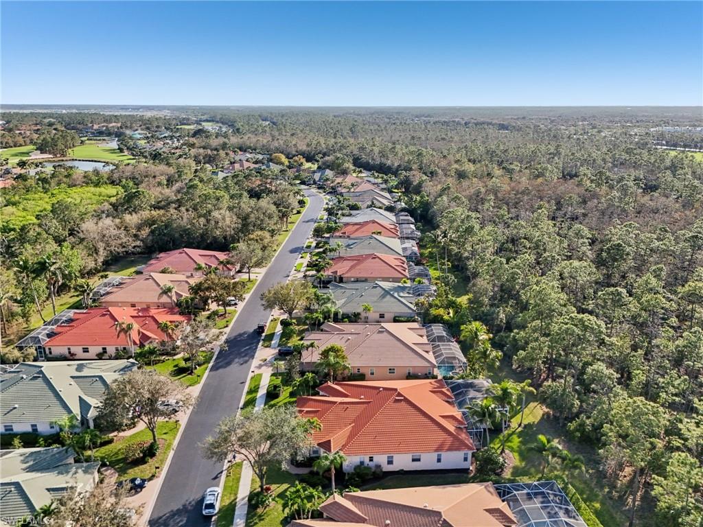 3553 Periwinkle Way Naples, FL 34114 - Photo 36 of 43 Birds eye view of property with a forest view and a residential view