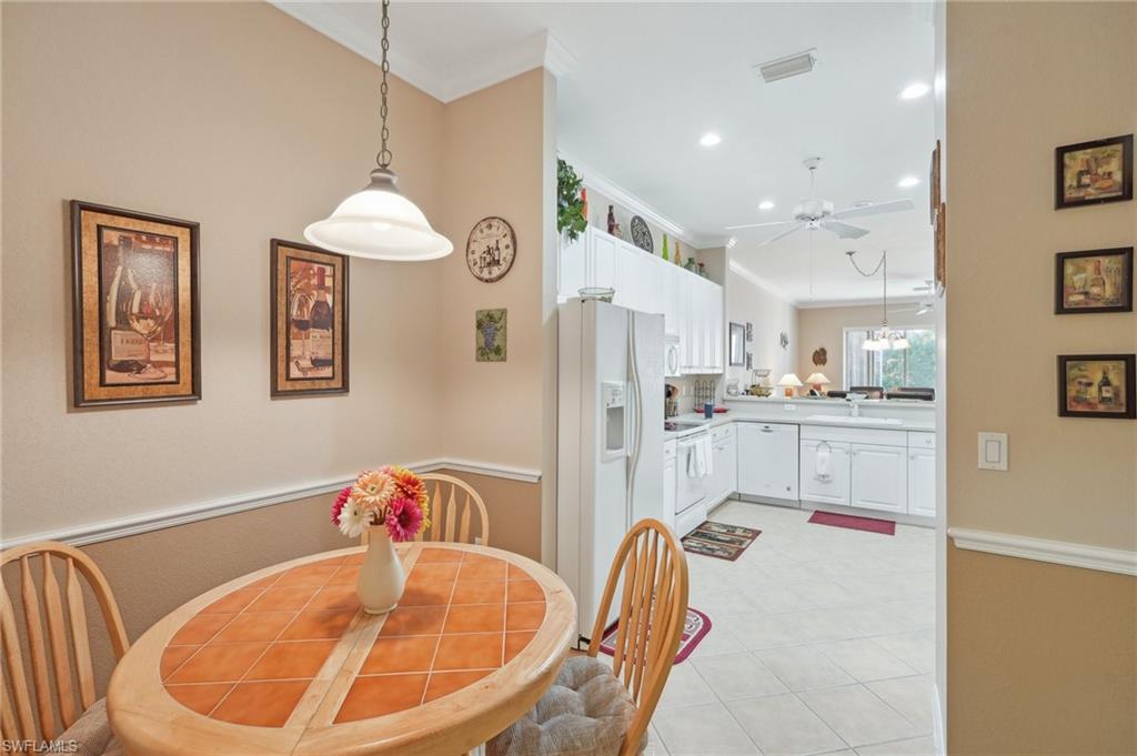 3553 Periwinkle Way Naples, FL 34114 - Photo 10 of 43 Dining area featuring visible vents, recessed lighting, a ceiling fan, and ornamental molding