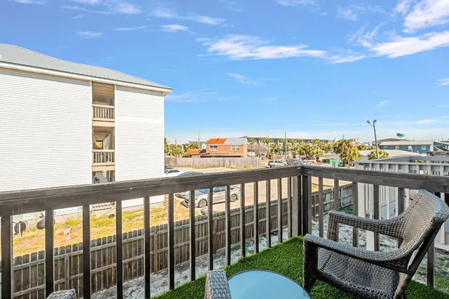 a view of a balcony with chairs