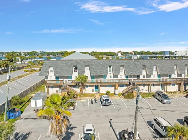 a view of a lake with couches chairs