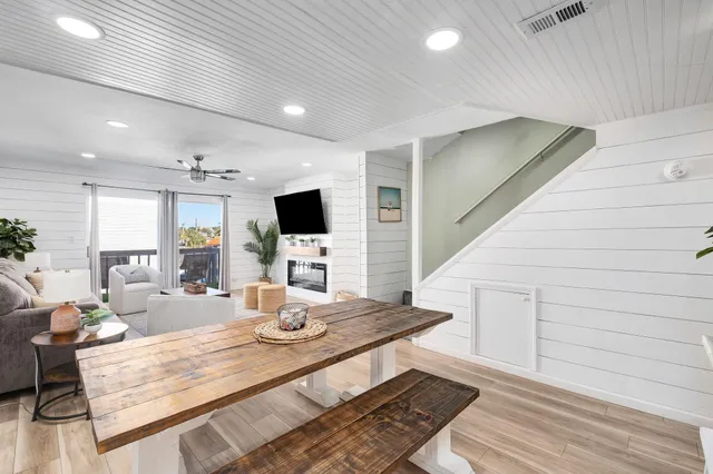 a living room with furniture and flat screen tv