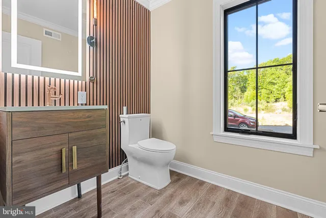 a bathroom with a toilet and shower