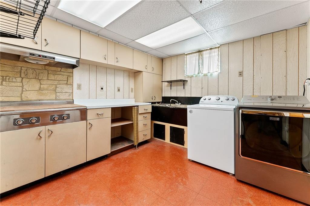 1008 Thorn Run Road Coraopolis, PA 15108 - Photo 16 of 28 a kitchen with a stove top oven sink and cabinets