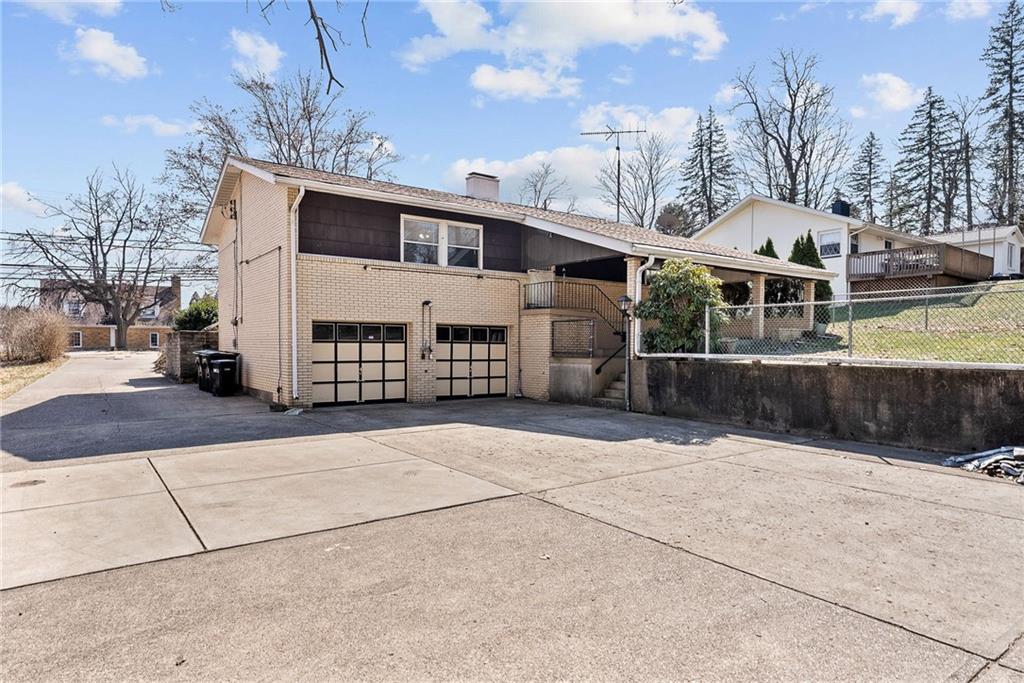 1008 Thorn Run Road Coraopolis, PA 15108 - Photo 22 of 28 a front view of a house with a yard
