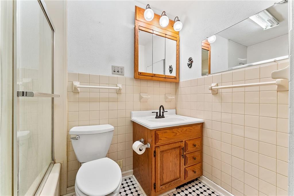 1008 Thorn Run Road Coraopolis, PA 15108 - Photo 10 of 28 a bathroom with a toilet sink and mirror