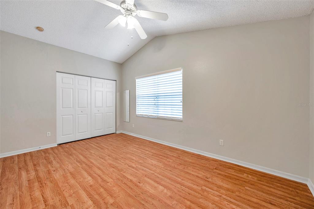 2739 Enterprise Road East, Unit 1 Clearwater, FL 33759 - Photo 15 of 20 wooden floor in an empty room with a window