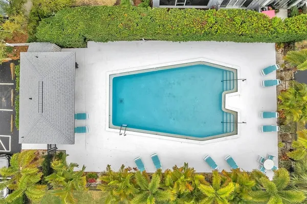 a view of a swimming pool with a patio