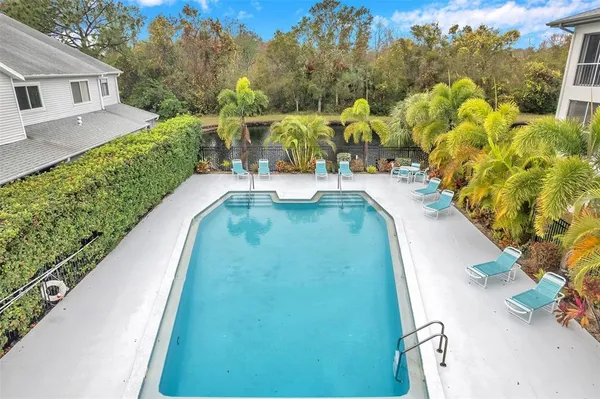 an aerial view of a house with a lake view