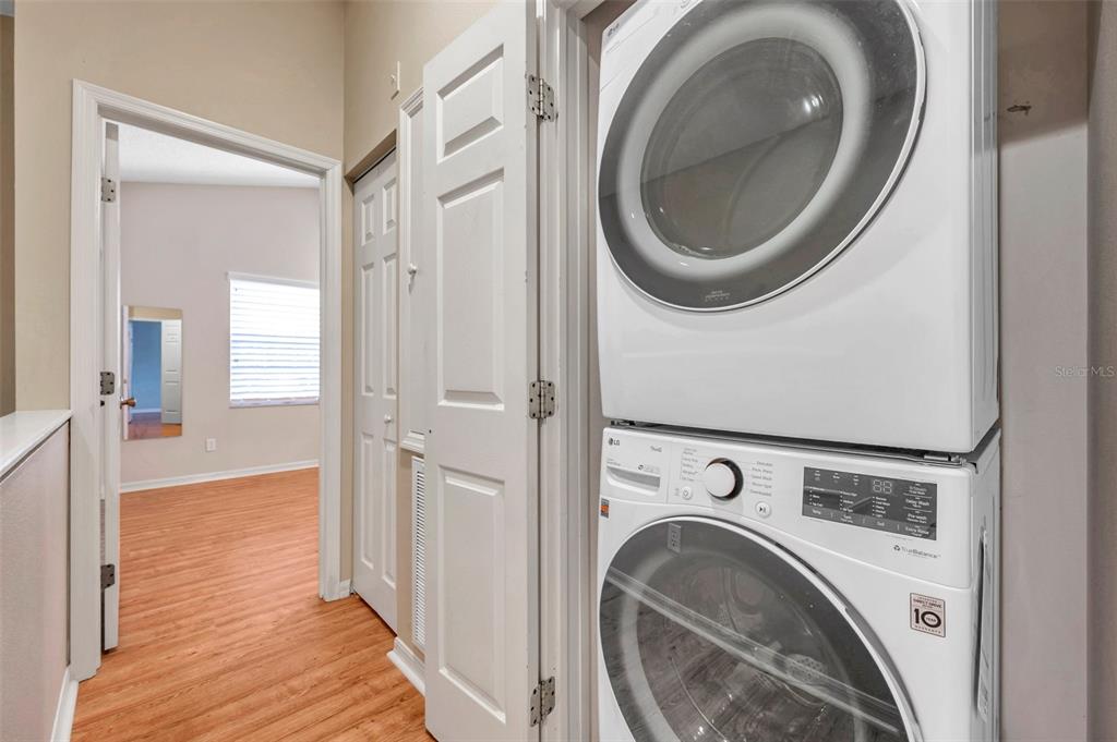 2739 Enterprise Road East, Unit 1 Clearwater, FL 33759 - Photo 10 of 20 a view of a hallway with washer and dryer