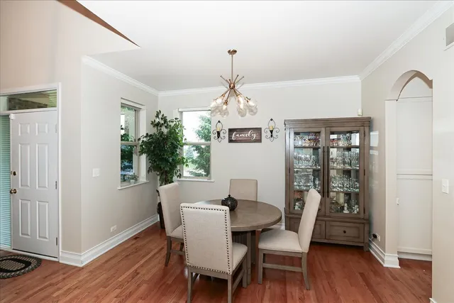 a dining room with furniture window wooden floor