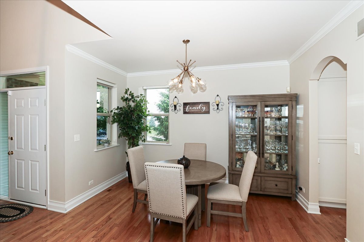 768 St Johns Place Addison, IL 60101 - Photo 12 of 39 a dining room with furniture window wooden floor