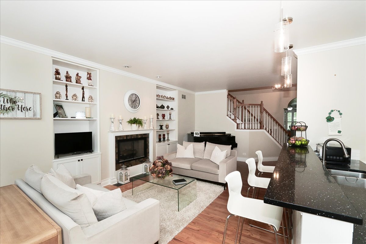 768 St Johns Place Addison, IL 60101 - Photo 6 of 39 a living room with furniture and a fireplace