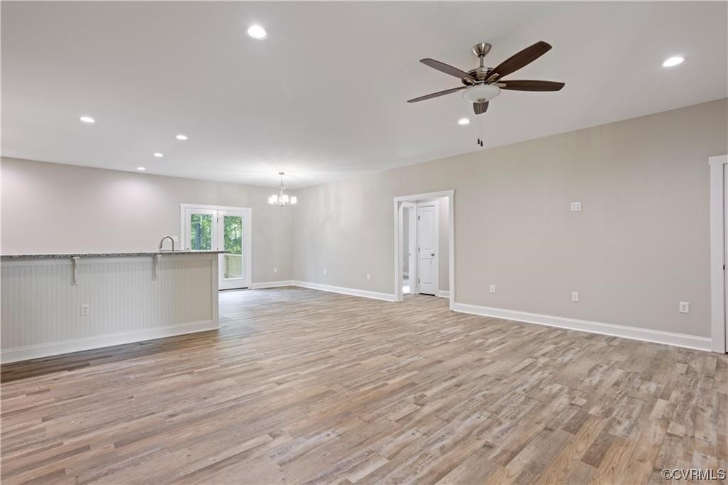 3734 Fredericks Hall Road Mineral, VA 23117 - Photo 4 of 9 an empty room with wooden floor and windows