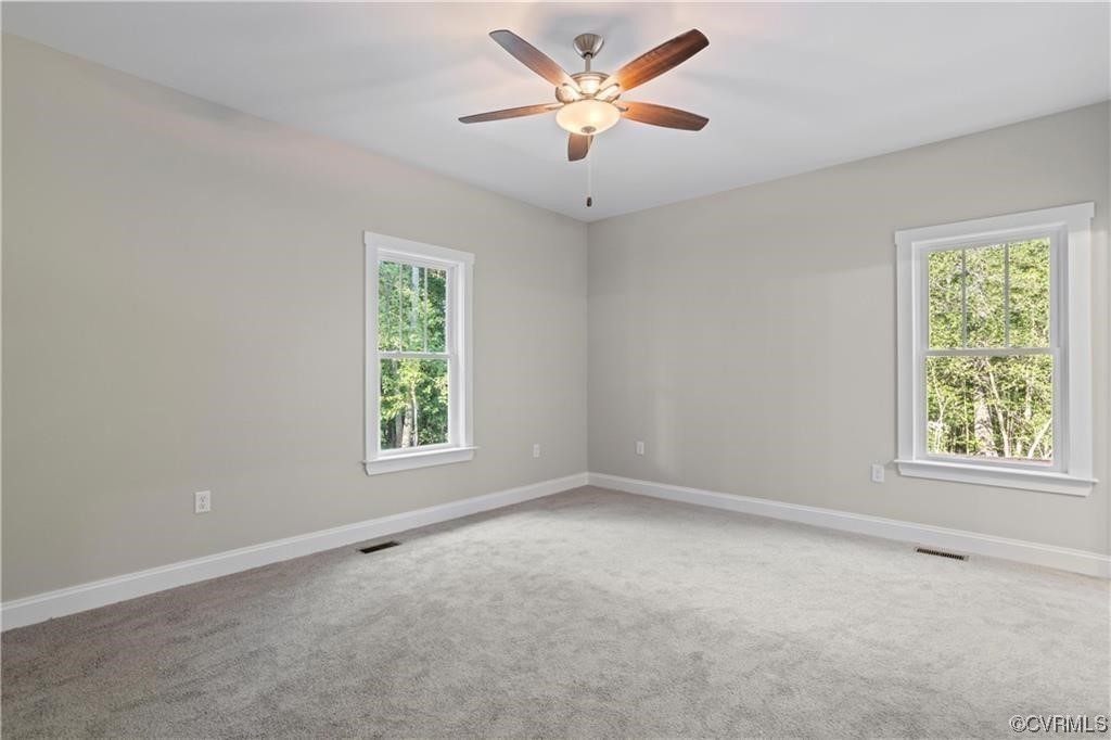 3734 Fredericks Hall Road Mineral, VA 23117 - Photo 9 of 9 an empty room with a window and a fan