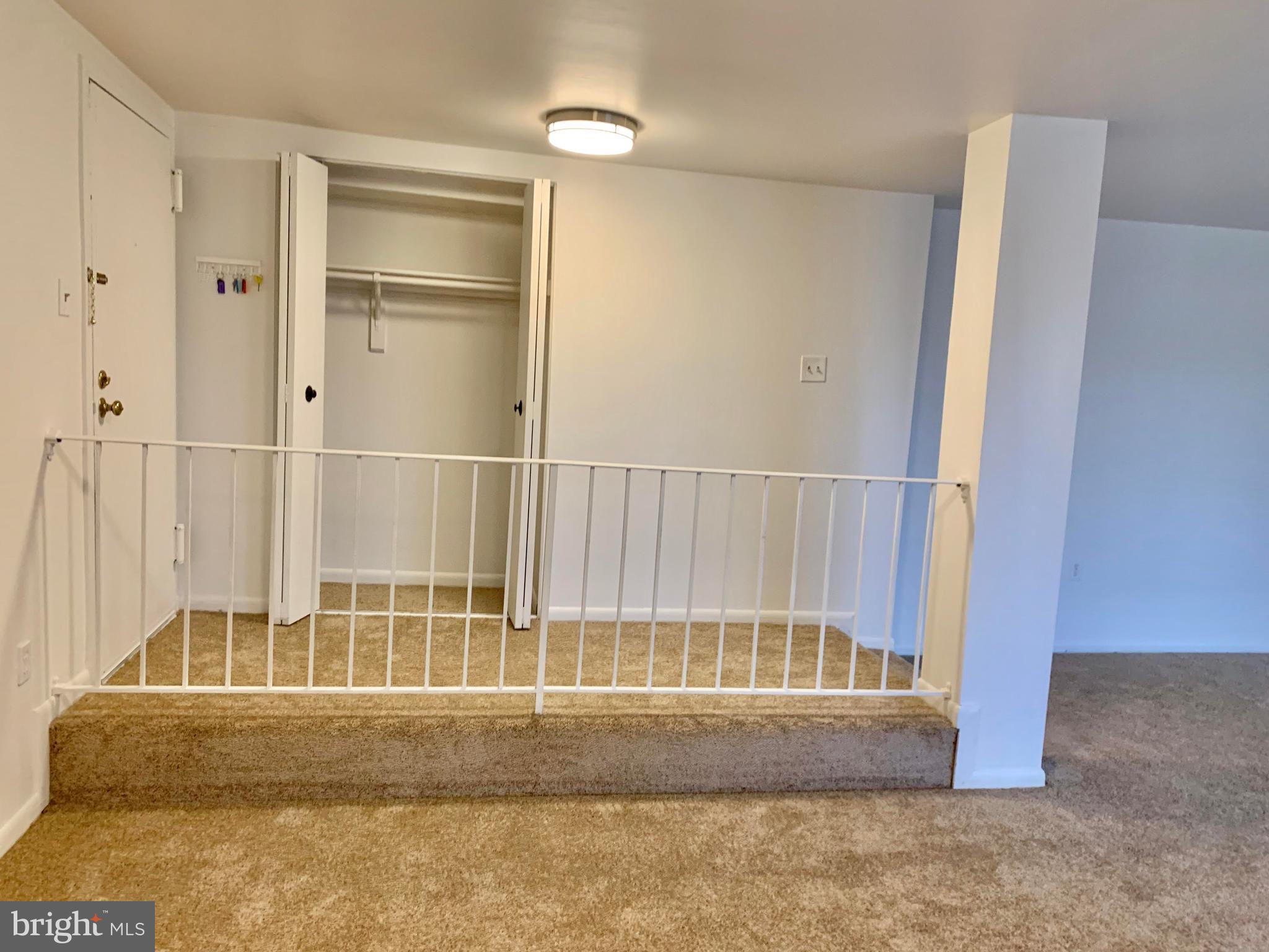 15702 Dorset Road, Unit 138 Laurel, MD 20707 - Photo 2 of 25 FOYER ENTRANCE AND COAT CLOSET NEW LIGHT FIXTURE