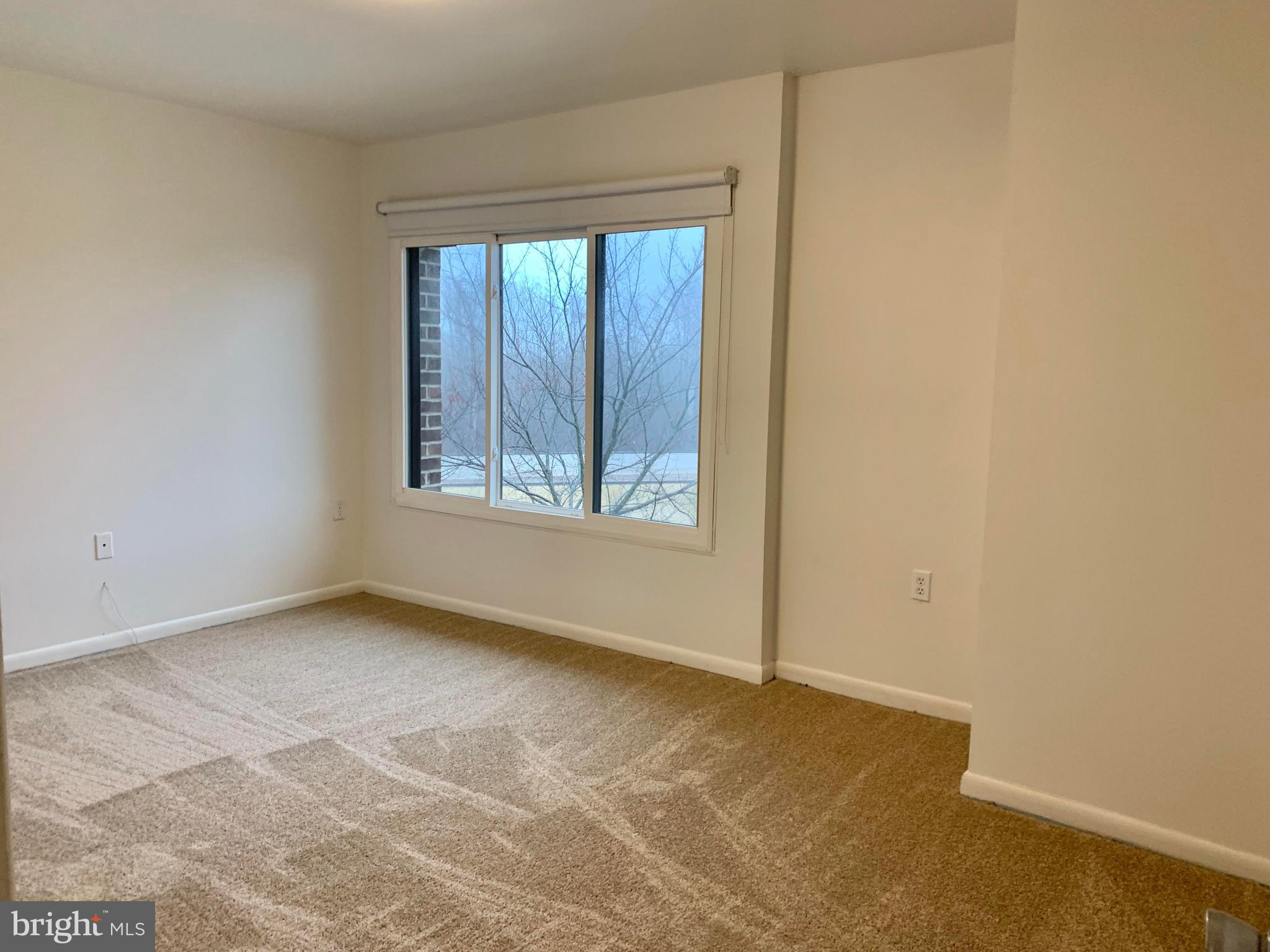 15702 Dorset Road, Unit 138 Laurel, MD 20707 - Photo 18 of 25 MASTER BED RM HAS LARGE WINDOW OVERLOOKING POOL