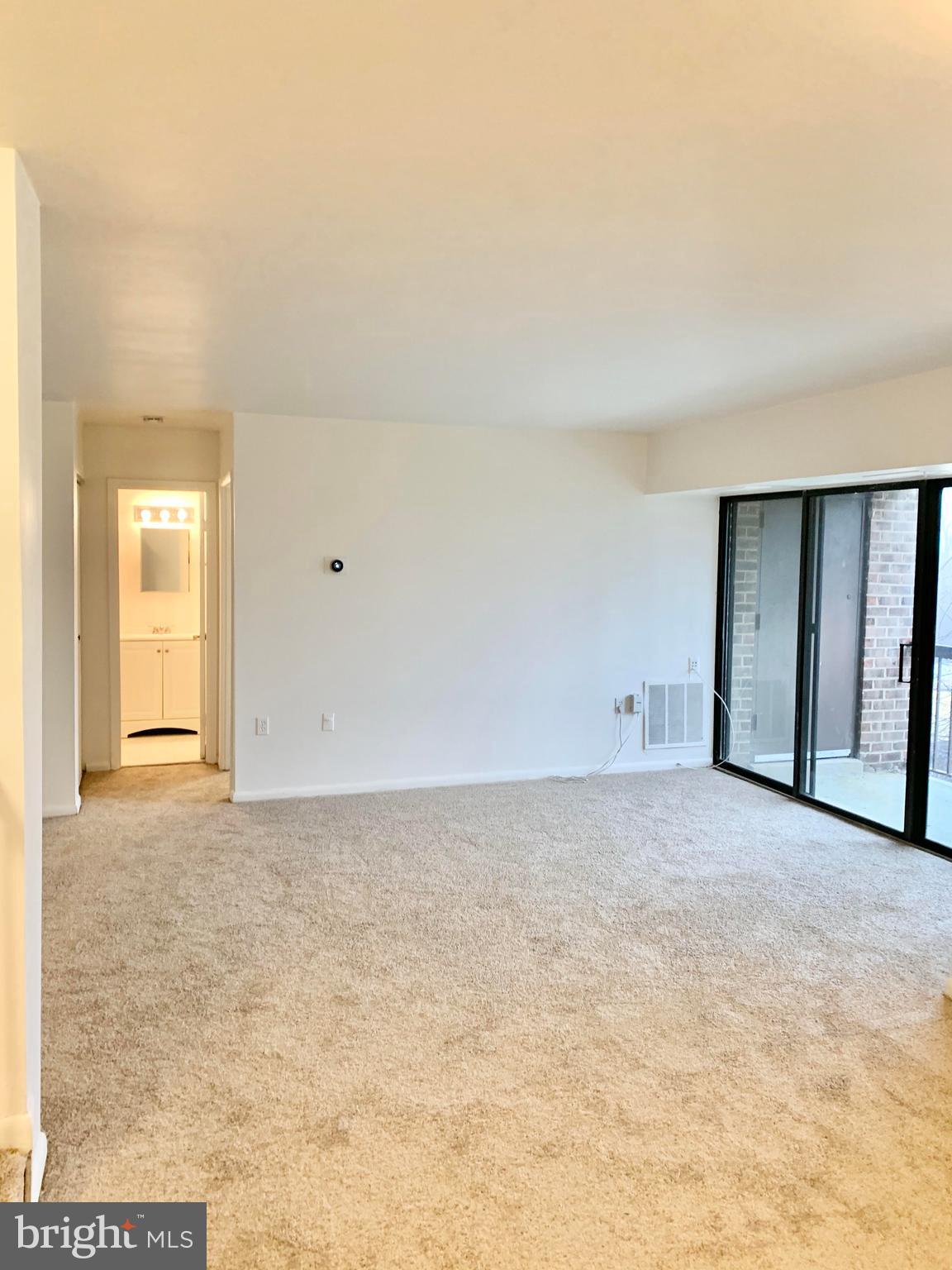 15702 Dorset Road, Unit 138 Laurel, MD 20707 - Photo 6 of 25 WALK OUT TO BALCONY FROM LIVING ROOM