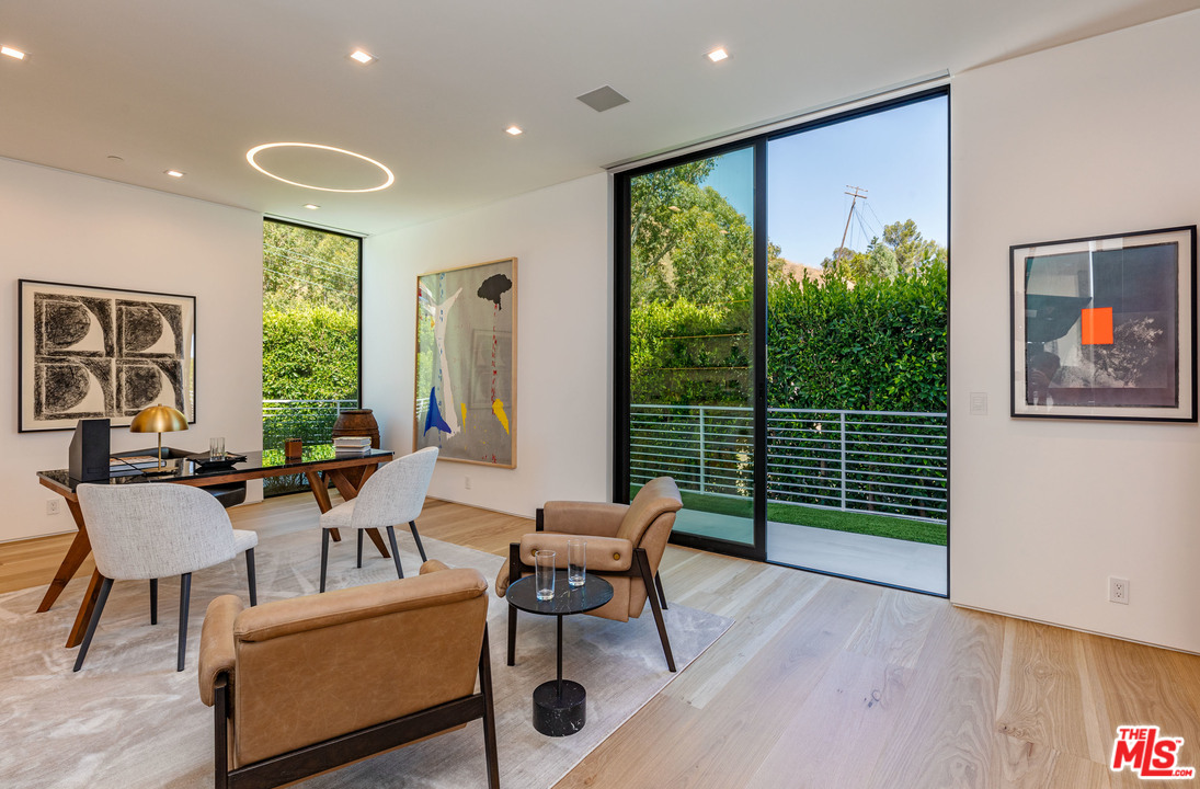 1259 Beverly Estate Drive Beverly Hills, CA 90210 - Photo 16 of 43 a living room with furniture and a large window
