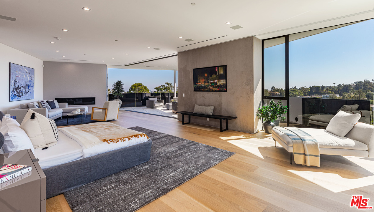 1259 Beverly Estate Drive Beverly Hills, CA 90210 - Photo 20 of 43 a living room with furniture and a flat screen tv